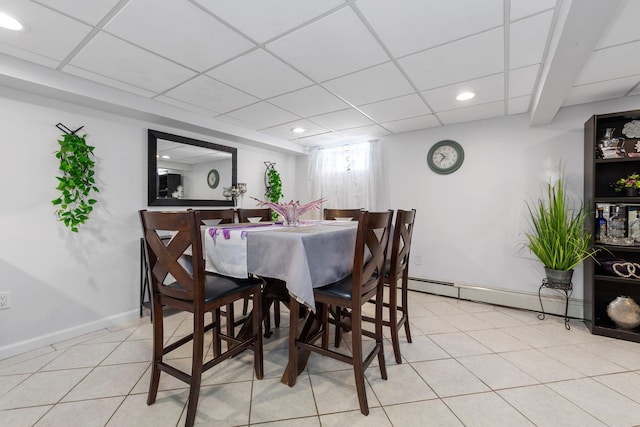 dining space featuring baseboards, a baseboard heating unit, recessed lighting, and light tile patterned flooring