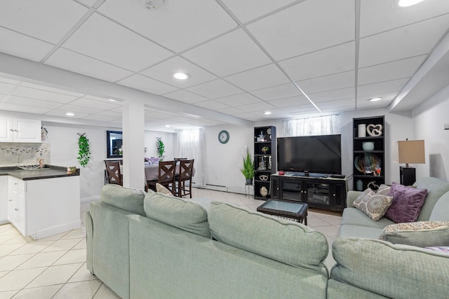 living area with light tile patterned flooring, baseboards, and recessed lighting