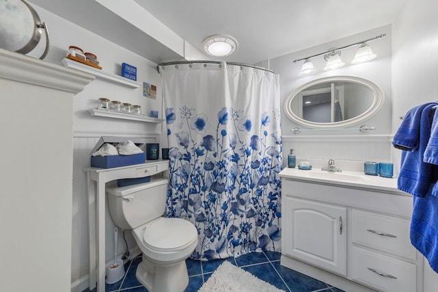 bathroom featuring toilet, tile patterned floors, a shower with curtain, and vanity
