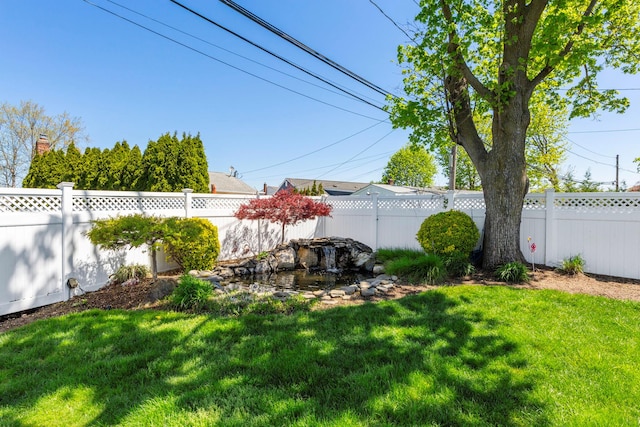 view of yard featuring a fenced backyard