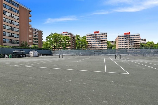 view of tennis court with fence