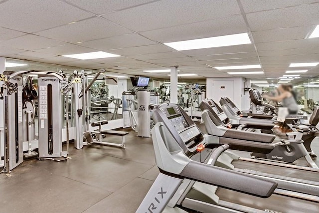 exercise room featuring a paneled ceiling
