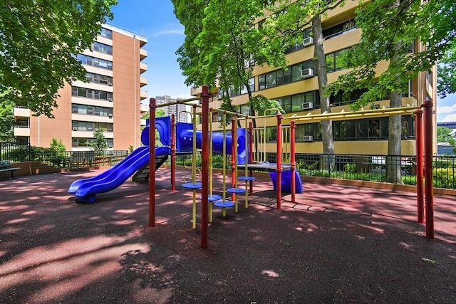 communal playground featuring fence