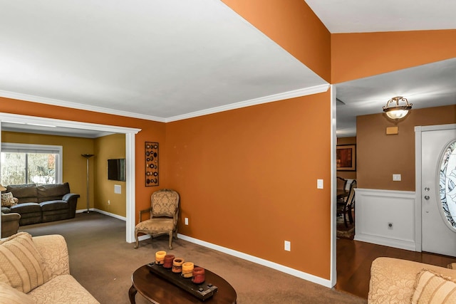 living room featuring baseboards, ornamental molding, and carpet flooring