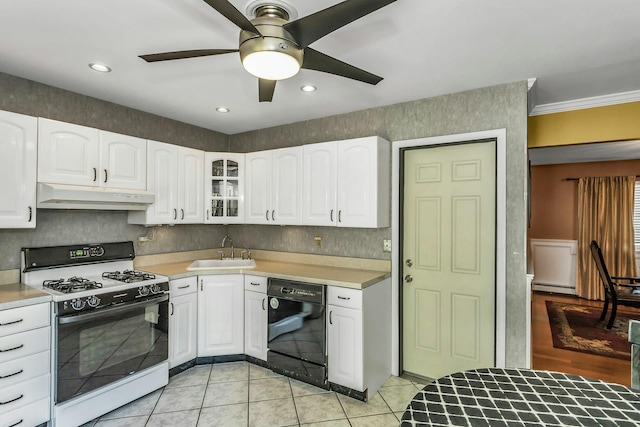 kitchen with a sink, range with gas stovetop, black dishwasher, a ceiling fan, and under cabinet range hood