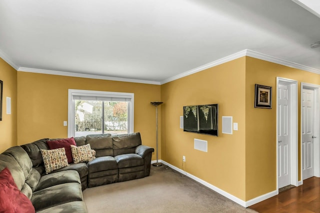 living area with crown molding and baseboards