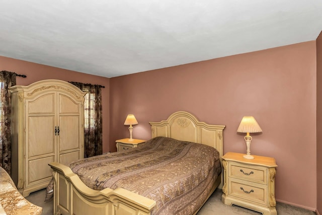 bedroom featuring light colored carpet