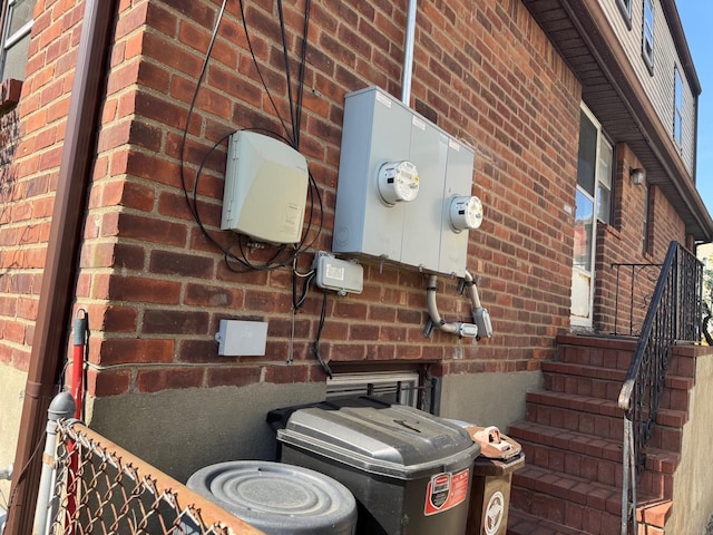 exterior details with brick siding and electric meter