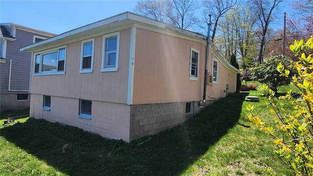 view of side of property with a yard