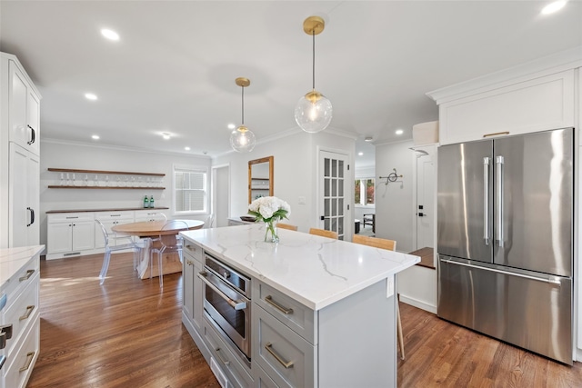 kitchen with ornamental molding, stainless steel appliances, and recessed lighting