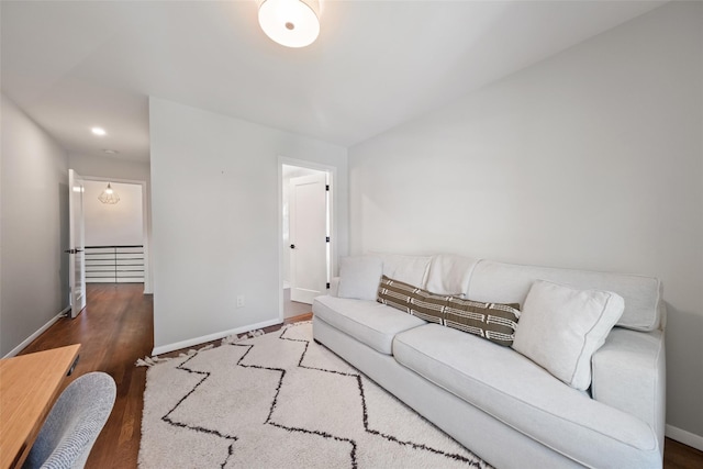 living area featuring recessed lighting, baseboards, and wood finished floors