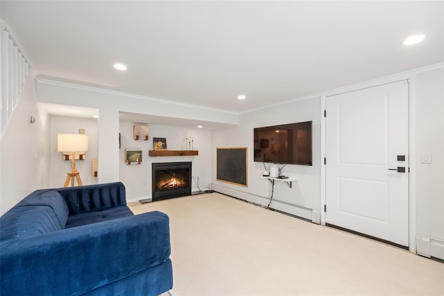 living area featuring recessed lighting, crown molding, and a lit fireplace