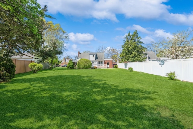 view of yard featuring a fenced backyard