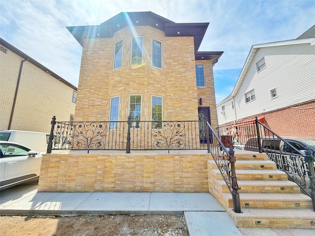 103-22 104th St, Ozone Park, NY 11417 - view of front facade featuring stairs and brick siding