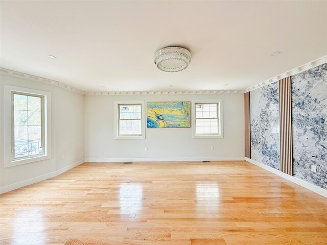 103-22 104th St, Ozone Park, NY 11417 - empty room with baseboards, a wealth of natural light, and light wood finished floors
