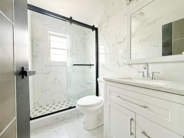 103-22 104th St, Ozone Park, NY 11417 - full bathroom with vanity, marble finish floor, toilet, tile walls, and a marble finish shower