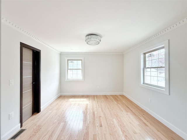 103-22 104th St, Ozone Park, NY 11417 - unfurnished bedroom featuring crown molding, baseboards, light wood-type flooring, and visible vents