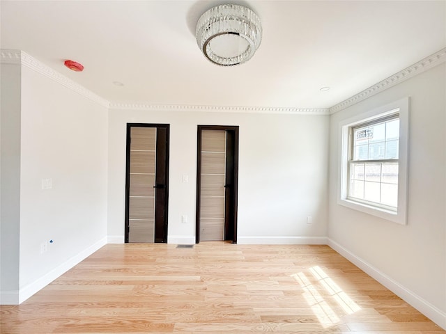 103-22 104th St, Ozone Park, NY 11417 - unfurnished bedroom featuring baseboards, two closets, and light wood finished floors