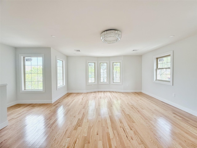 103-22 104th St, Ozone Park, NY 11417 - unfurnished living room with plenty of natural light and light wood-style floors