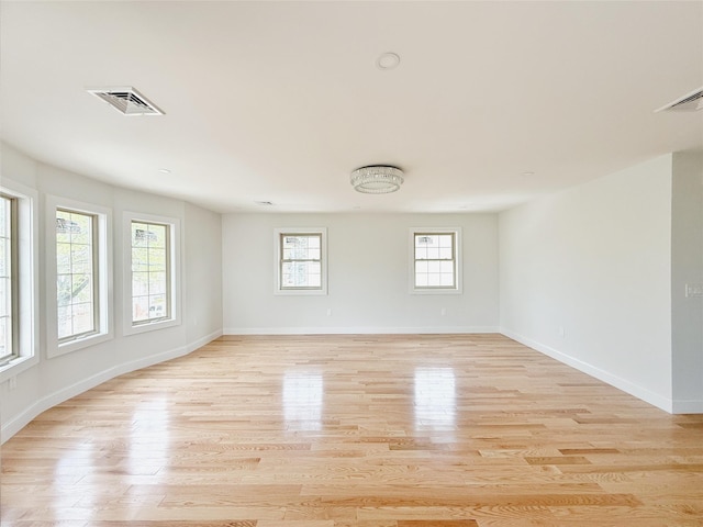 103-22 104th St, Ozone Park, NY 11417 - spare room with baseboards, light wood-type flooring, and visible vents