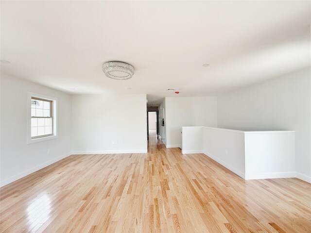 103-22 104th St, Ozone Park, NY 11417 - empty room featuring light wood-style floors and baseboards
