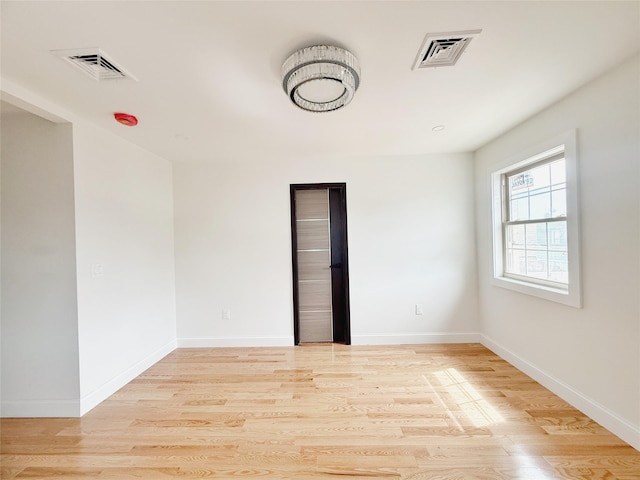 103-22 104th St, Ozone Park, NY 11417 - empty room with visible vents, baseboards, and wood finished floors