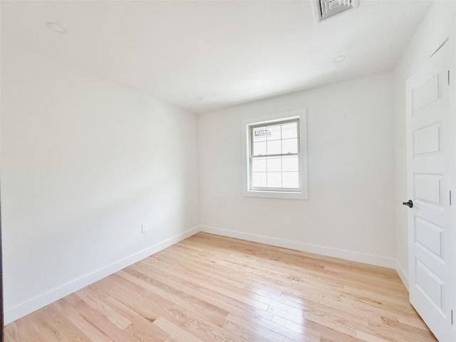 103-22 104th St, Ozone Park, NY 11417 - spare room featuring baseboards, visible vents, and light wood-style floors
