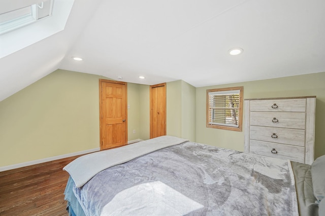 bedroom with a closet, dark wood-style flooring, baseboards, recessed lighting, and vaulted ceiling