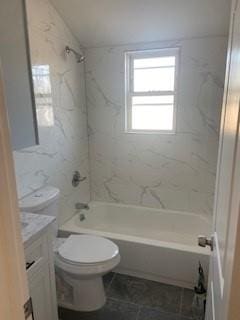bathroom featuring vanity, bathing tub / shower combination, and toilet