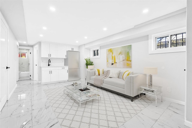 178-38 134th Ave, Springfield Gardens, NY 11434 - living room featuring baseboards, marble finish floor, recessed lighting, and a wealth of natural light