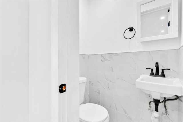178-38 134th Ave, Springfield Gardens, NY 11434 - bathroom featuring toilet and tile walls