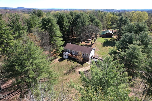 aerial view featuring a view of trees