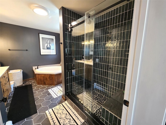 bathroom with vanity, tile patterned flooring, a stall shower, and a bath