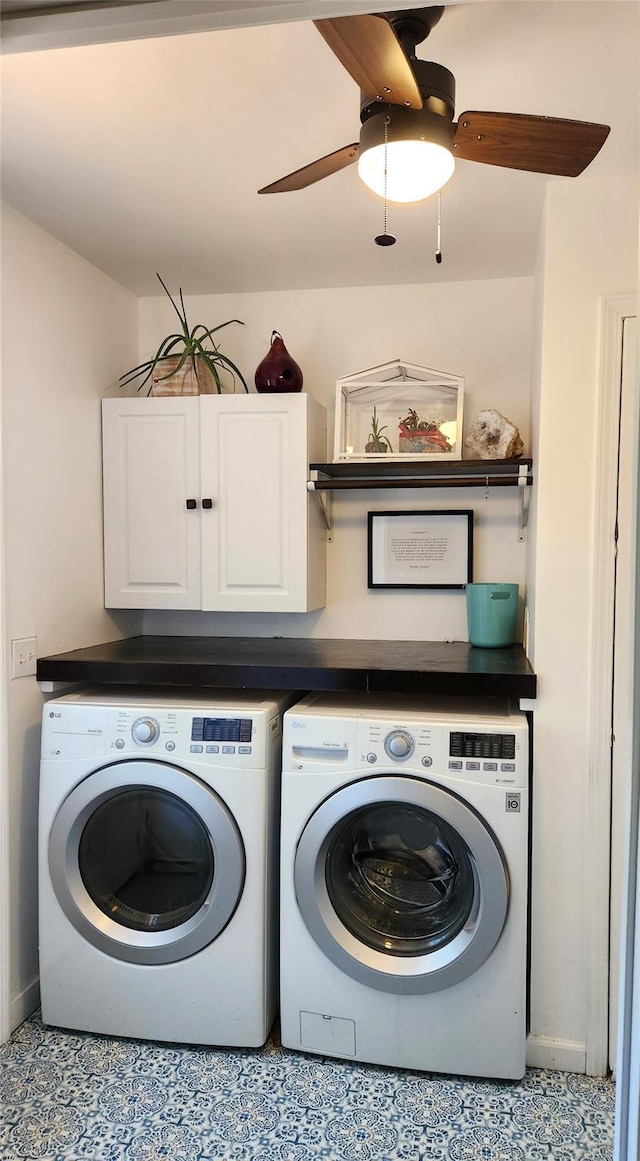 laundry area with cabinet space, a ceiling fan, and washing machine and dryer