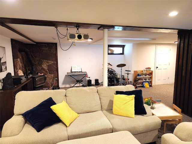 carpeted living area featuring a wood stove