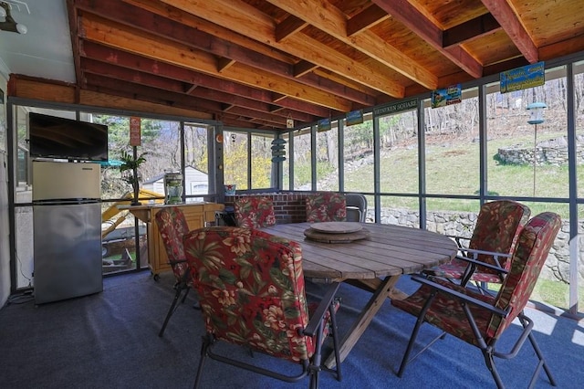sunroom / solarium featuring plenty of natural light