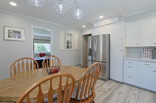 dining area with crown molding, recessed lighting, light wood finished floors, and a baseboard radiator