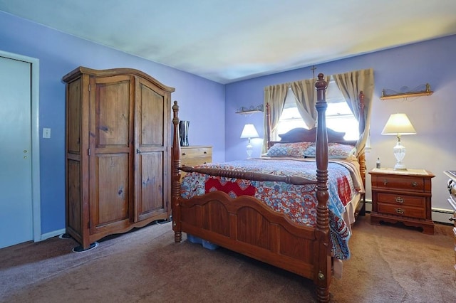carpeted bedroom with baseboard heating