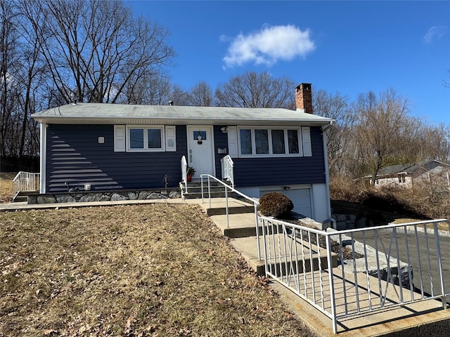 102 Capt Shankey Dr, Garnerville, NY 10923 - view of front facade with a chimney, an attached garage, driveway, and fence