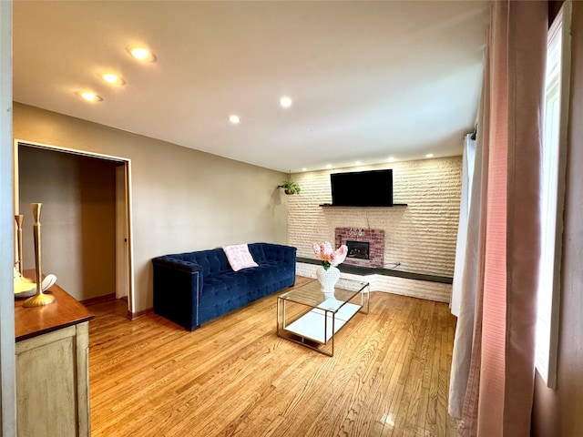 102 Capt Shankey Dr, Garnerville, NY 10923 - living area with a fireplace, light wood finished floors, recessed lighting, and baseboards