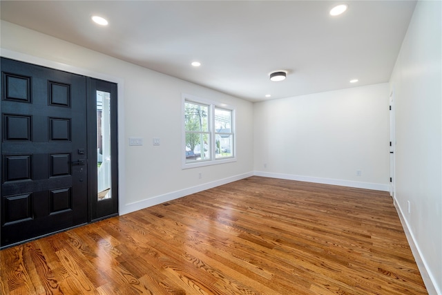 entrance foyer featuring recessed lighting, baseboards, and wood finished floors
