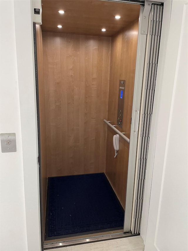 room details with recessed lighting and elevator