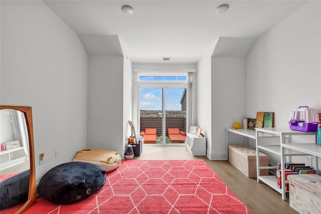 interior space featuring visible vents and wood finished floors