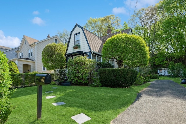 67 Summers St, Oyster Bay, NY 11771 - exterior space featuring a yard, a chimney, and a gambrel roof