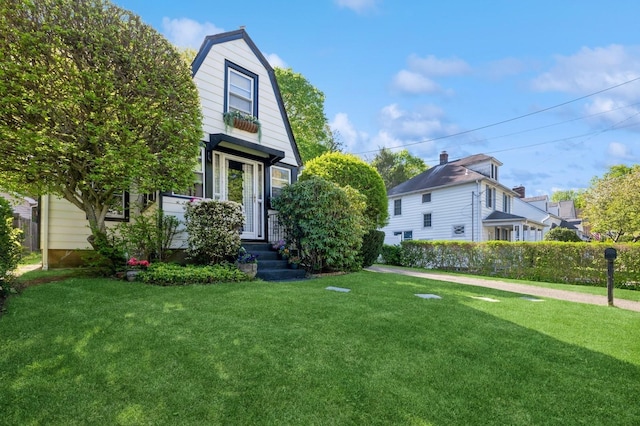 67 Summers St, Oyster Bay, NY 11771 - view of front of house with a front lawn and a gambrel roof