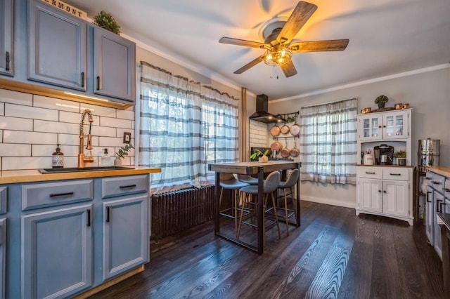 67 Summers St, Oyster Bay, NY 11771 - dining room featuring a ceiling fan, ornamental molding, and dark wood-type flooring
