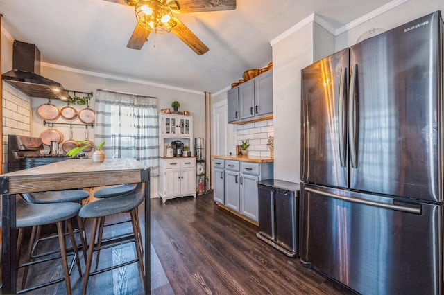 67 Summers St, Oyster Bay, NY 11771 - kitchen with freestanding refrigerator, ornamental molding, ceiling fan, tasteful backsplash, and dark wood finished floors