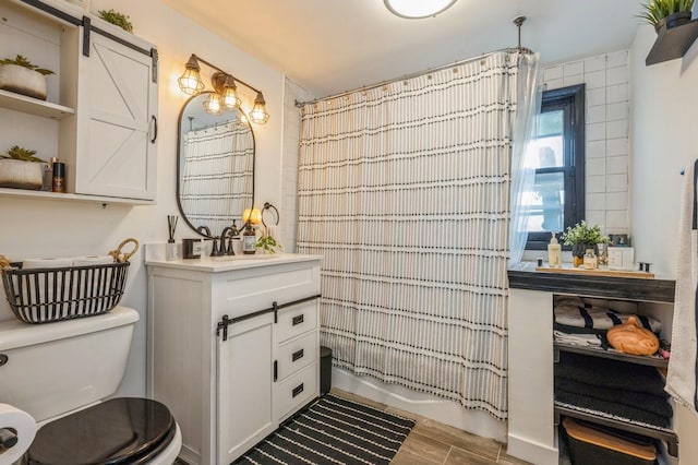 67 Summers St, Oyster Bay, NY 11771 - bathroom with vanity, shower / tub combo with curtain, wood finished floors, and toilet