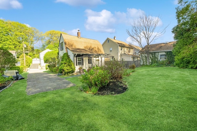 67 Summers St, Oyster Bay, NY 11771 - rear view of property with a yard, fence, and a pergola