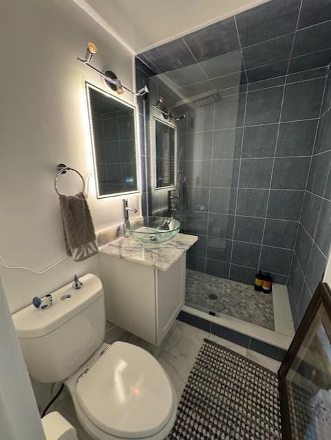 1 David Ln Unit 5E, Yonkers, NY 10701 - bathroom featuring vanity, tiled shower, toilet, and marble look tile flooring